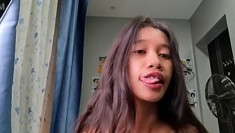 A Tiny Asian Woman Who Is Petite In Size